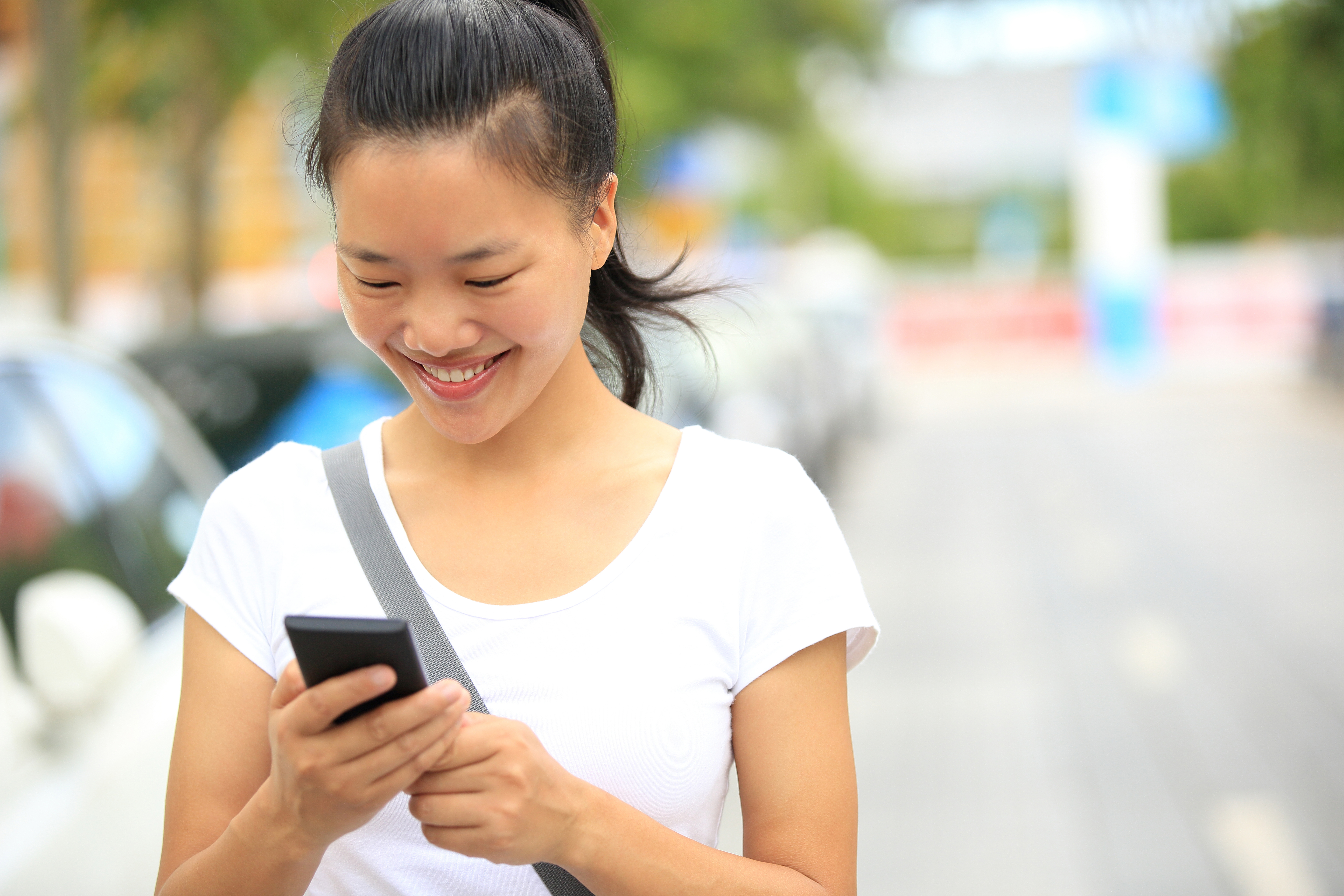 Patient making a self-service phone payment on her cell phone