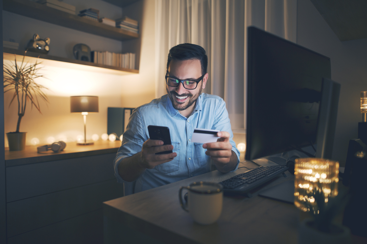 Man making an evening payment by phone