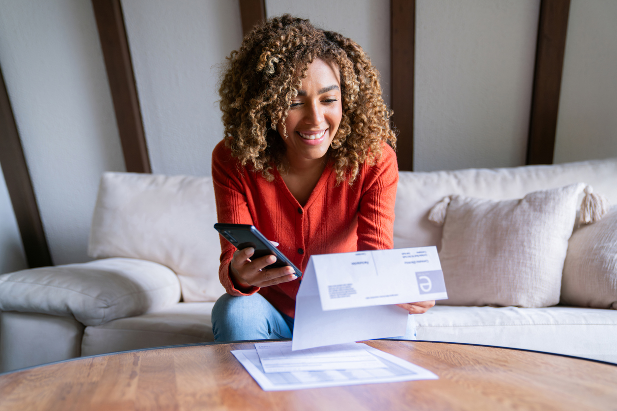Woman securely paying her balance by phone.